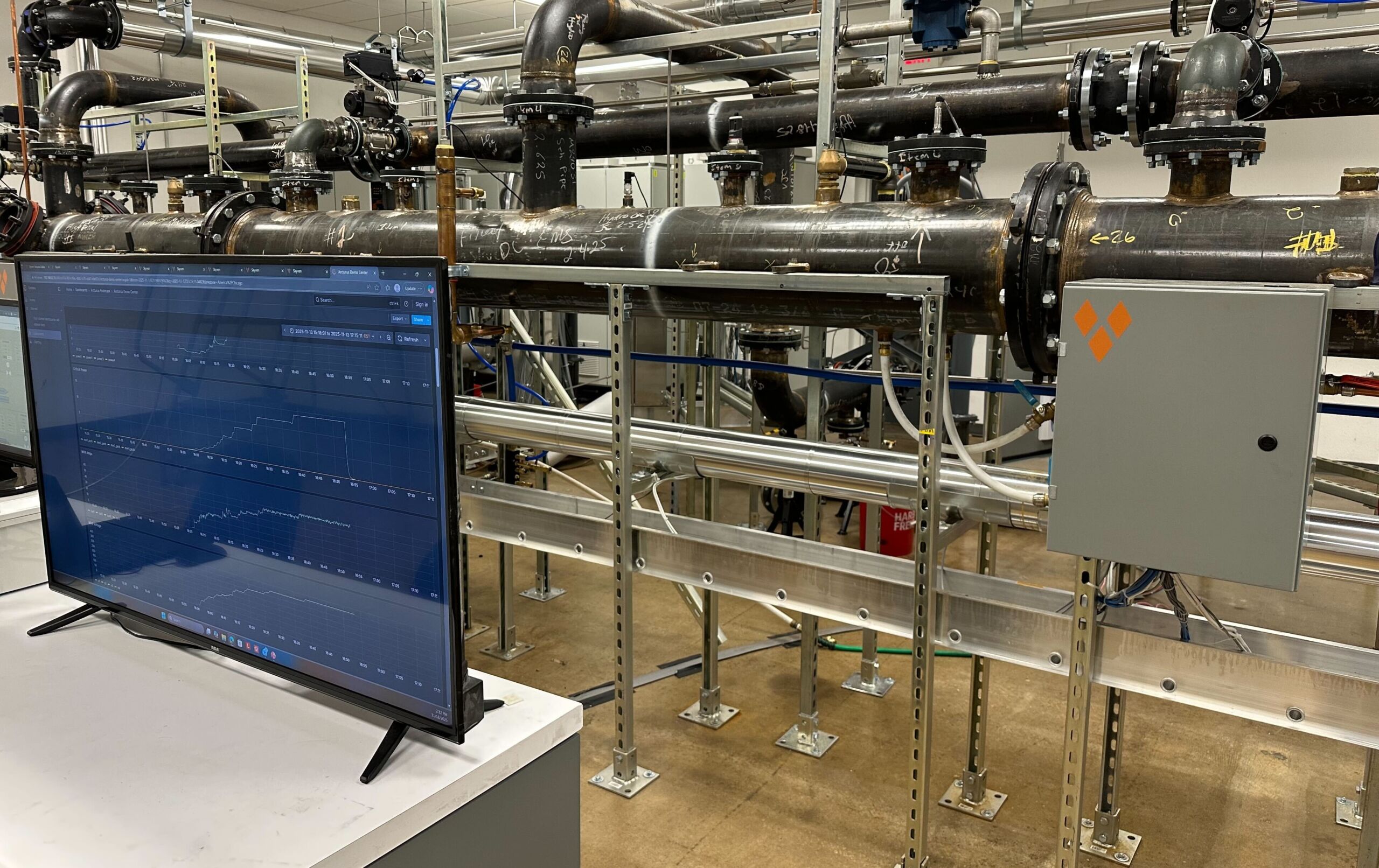 Skyven's Arcturus steam-generating heat pump with a monitor in front